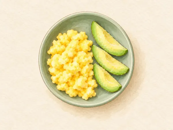 Soft scrambled egg with avocado fingers